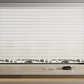 White Vertical Blinds with Clean Lines Above Wooden Countertop and Green Outdoor View