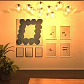 Modern Interior Featuring Abstract Painting on Wall with Multiple Art Paintings Crystal Chandelier and Green Plant