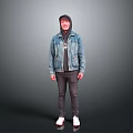 Man Wearing Hoodie And Denim Jacket With Dark Pants And White Shoes Against Gray Background