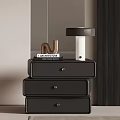 Black Drawer Bedside Table With Architecture Books Table Lamp And Decorative N
