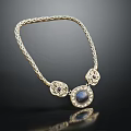 Elegant Braided Gold Necklace With Blue Gemstone And Ornate Decorative Pendants Design