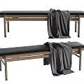Wooden Frame Bench With Black Cushion And Gray Blanket On Top