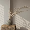 Gray Ceramic Vase With White Berry Branches On Wooden Stump In Sunlight Shadows