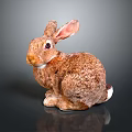 Sitting Rabbit Figurine With Brown White Fur And Smooth Surface 3d model