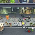 Creative Garden Decor With Bicycle Planters And Potted Plants On Stone Paved Outdoor Area