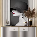 Modern Entryway Side Cabinet With Striped Doors Golden Trim And Decorative Artwork