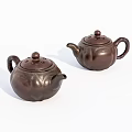 Two Traditional Brown Clay Teapots with Classic Design and Smooth Surface