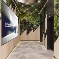 Elevator Lobby Featuring Green Plant Wall Display Screen Wooden Decor And Geometric Ceiling