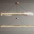 Two Modern Circular Chandeliers With Metal Frame And Glass Elements Mounted On Gray Paneled Wall