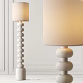 Modern Floor Lamp With Stacked Spherical Base And Beige Lampshade Design