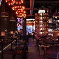 Industrial Bar Interior Design With Brick Walls Pendant Lights And Neon Signs