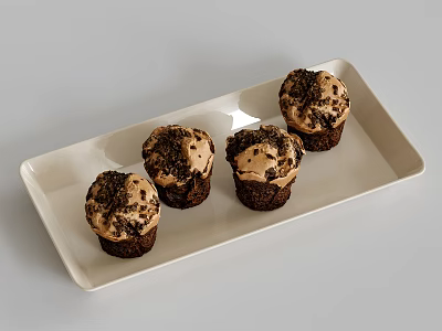 Four Chocolate Cupcakes With Cream Frosting And Chocolate Crumbs On White Rectangular Tray 3d model
