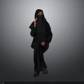Child In Traditional Black Robe Standing Against Gray Background Full View