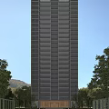 High Rise Residential Building With Glass Windows Surrounded By Trees And Mountain View