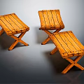 Three Wooden Folding Stools With Cross Legs And Natural Wood Grain