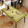 Elegant Dining Table Set With Green White Checkered Tablecloth Rattan Chairs And Decorative Tableware