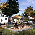 Scenic Campsite With Camper Van Tents Shade Umbrellas Wooden Tables Surrounding Trees And Green Grass