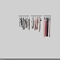 Various Styles Clothes Hanging On Hangers With Different Colors And Fashion Designs