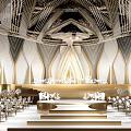 Elegant Banquet Hall With Ornate Ceiling Golden Decor Stage And Floral Arrangements
