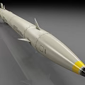 Tomahawk Missile Military Weapon With Yellow Tip Tail Fins And Cylindrical Body