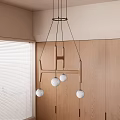Modern Chandelier With White Spherical Globes Above Wooden Cabinets And Window Blinds