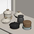 Modern Kitchen Cookware With Assorted Colored Pots And Lids On White Countertop 3d model