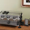 Stainless Steel Espresso Machine on Wooden Table with Menu Holders and Framed Art