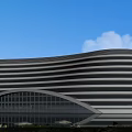 Modern Streamlined Commercial Complex With Glass Curtain Walls Waterfront And Greenery