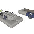 Modern Sectional Sofa In Light Gray Blue Gray With Plush Cushions Side Table And Plant