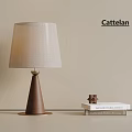 Cattelan Modern Table Lamp With Beige Fabric Lampshade Brown Cone Base And Decorative Star Near Books
