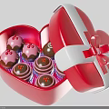 Open Red Heart Shaped Box Containing Decorated Cupcakes And Ribbon Bow