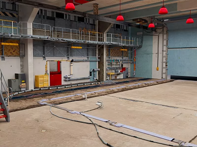 Cartoon Style Industrial Workshop Scene With Concrete Floor Metal Railings And Red Pendant Lights 3d model