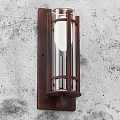 Rustic Wall Sconce With Wooden Frame And Clear Glass Shade On Textured Gray Wall