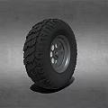 Off Road Vehicle Tire With Deep Tread Pattern And Silver Alloy Rim