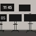 Multiple Televisions Some Wall Mounted and Some on Wheeled Stands Showing Time