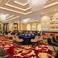 Luxurious Interior Design With Crystal Chandeliers Red Patterned Carpet Tables Chairs And Bar Counter