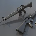 Two Metal Military Rifles With Detachable Magazine On Gray Surface