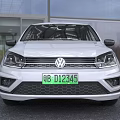 White Volkswagen Compact 5 Door Car With Stylish Front Grille And Headlights