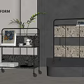 Two Modern Metal Wheeled Shelving Units with Plant Books and Patterned Storage