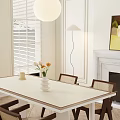 Modern Interior With Dining Table Set Wicker Chairs White Vase Flowers Floor Lamp And Fireplace