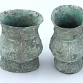 Pair Of Ancient Style Ceramic Vessels With Intricate Carvings And Green Patina