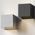 Two Cubic Concrete Wall Lamps Mounted On Wall With Warm Light Illumination