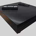 Modern Black Entertainment Media Player With Remote Control And Cassette Tape On Top
