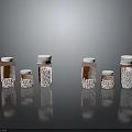 Household Medicine Bottles With Orange Bodies And White Caps In Various Sizes