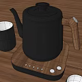 Sleek Black Tea Set with Wooden Handle Teapot and White Inner Teacups on Tabletop