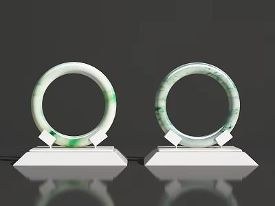 Two Elegant Natural Green Jade Bracelets On White Display Stands 3d model