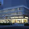 Modern ATOUR Hotel Building with Glass Facade and Illuminated Entrance Outdoor Seating Area at Dusk