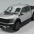 Silver Pickup Truck With Crew Cab Large Off Road Tires Black Grille And Cargo Bed