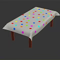 Table Covered With Colorful Polka Dot Tablecloth And Wooden Legs Design