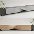Outdoor Chair Featuring Concrete and Wooden Wavy Design with Small Planter Holding Green Plants